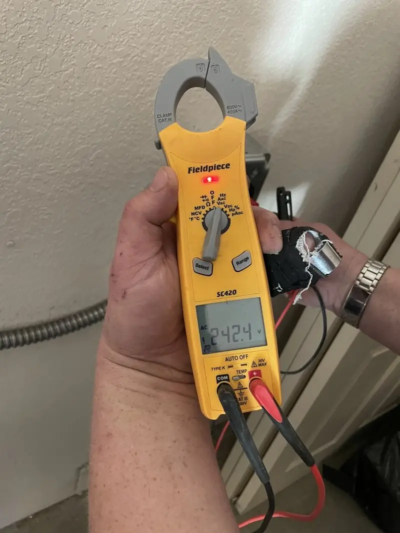 Voltage testing with clamp meter during Outlet Installation in Galt